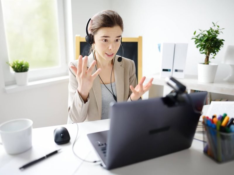 young-woman-is-learning-language-with-laptop-computer-camcorder-and-headphone-online-at-home-.jpg